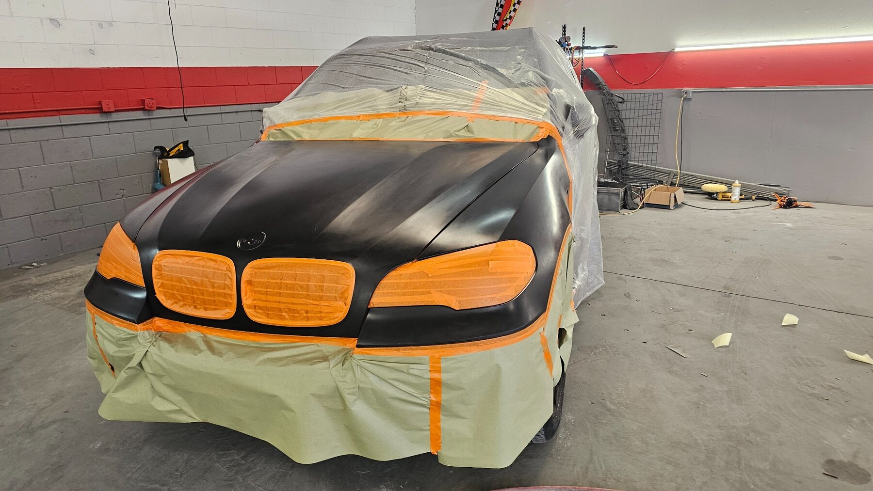 BMW front panels prepared and masked for refinishing