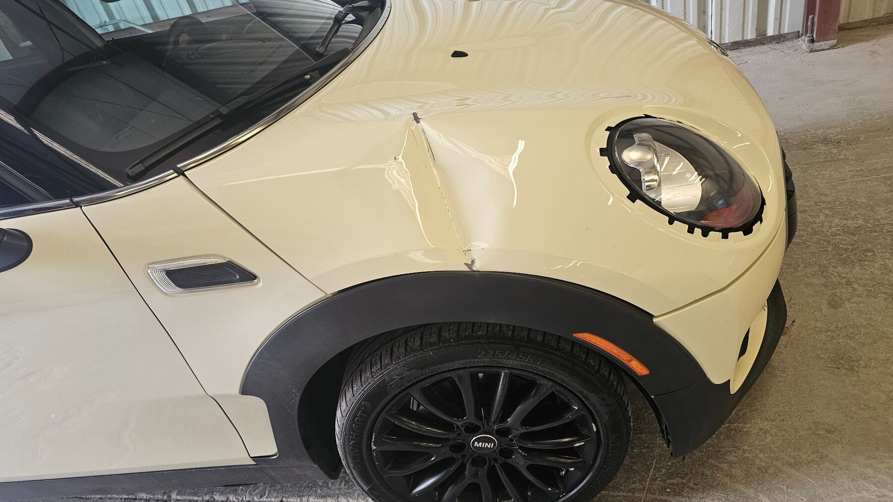 MINI front fender collision damage before repair