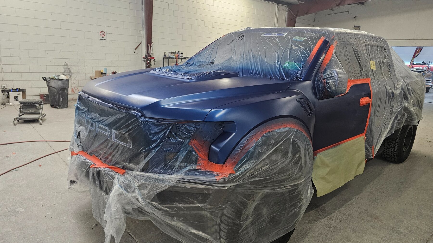 Ford Raptor front panels during blue color application
