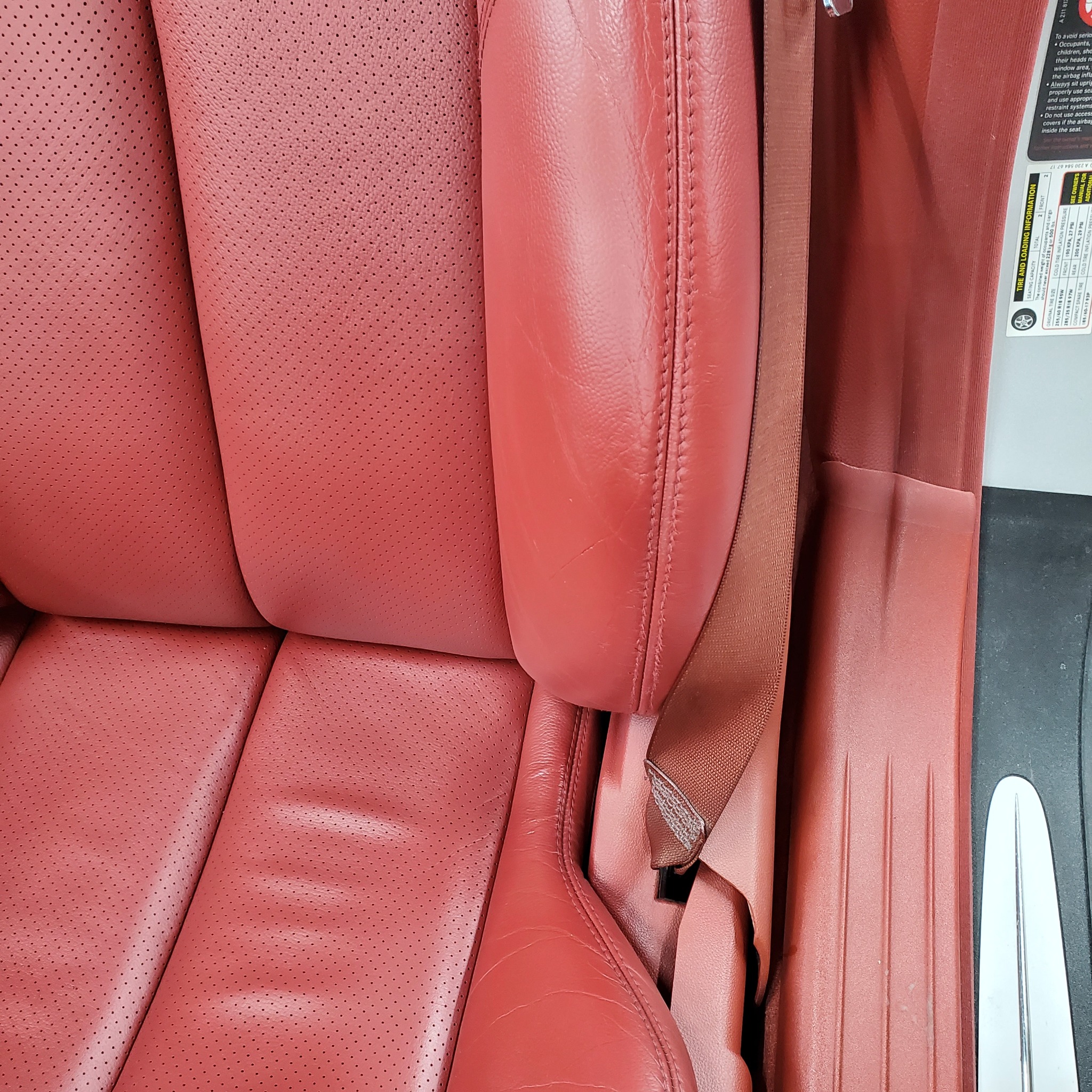 Red leather seat bolster after restoration